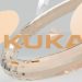 Orange kuka text surrounded by abstract geometric shapes.